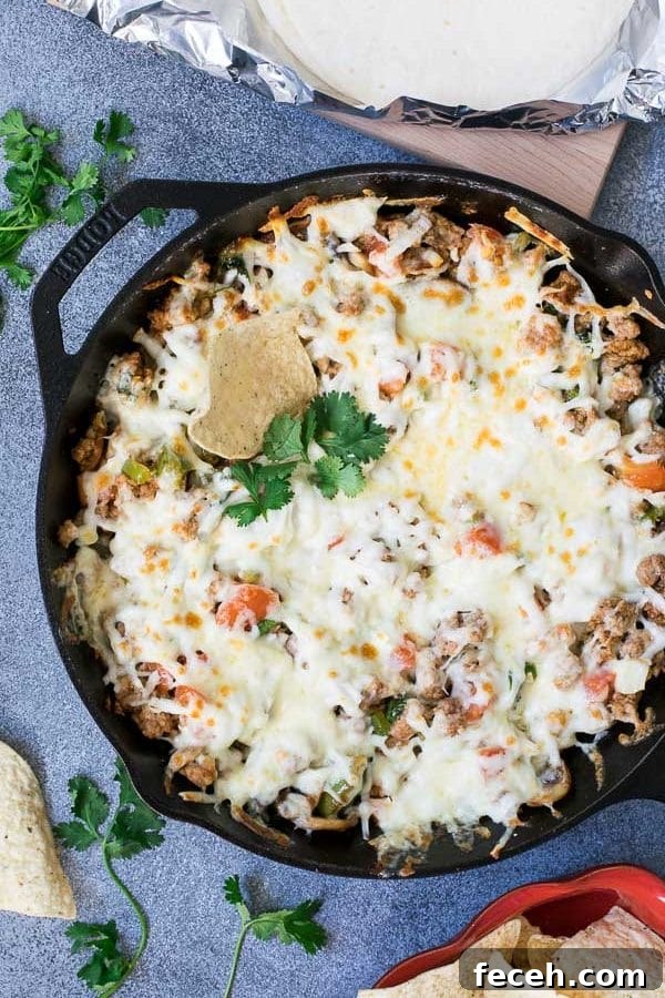 Queso fundido with chorizo in skillet