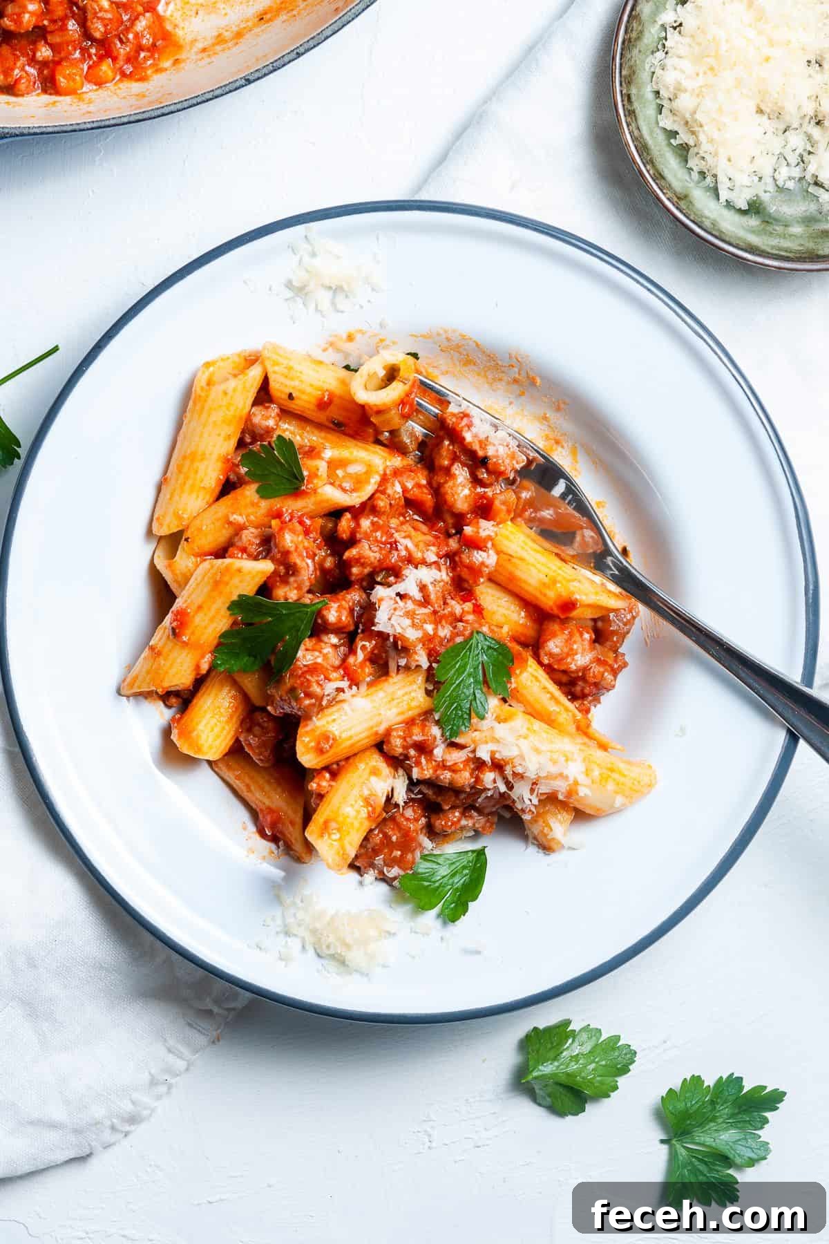 Dish of penne pasta, tossed in the ragu.
