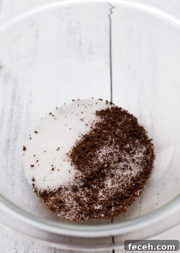 Equal amounts of instant coffee and sugar in a glass bowl.
