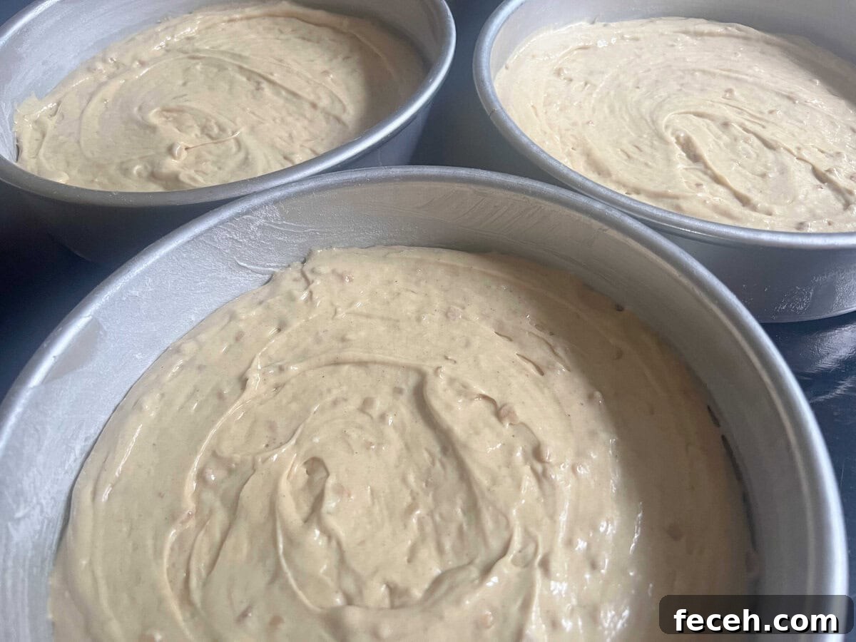Pans filled with cake batter.