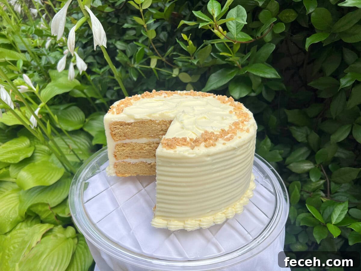 Brown Sugar Cake, sliced, on a pedestal.