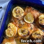 Apricot Jam chicken in a blue baking pan.