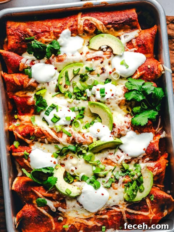 Ground Turkey Enchiladas served in a metal pan.