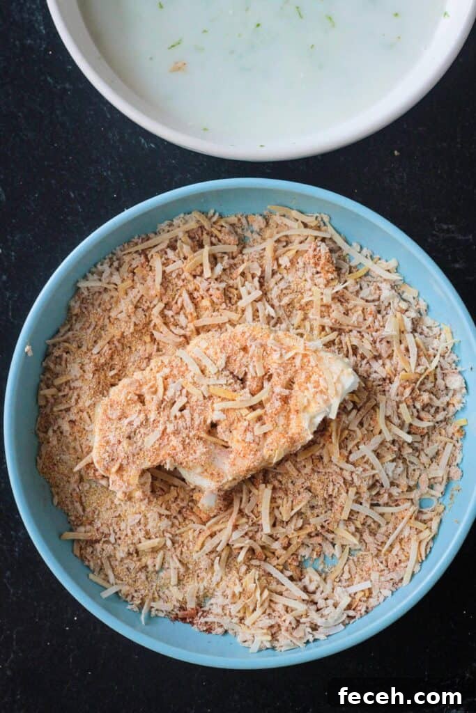 Slice of cauliflower coated in a crunchy breading.