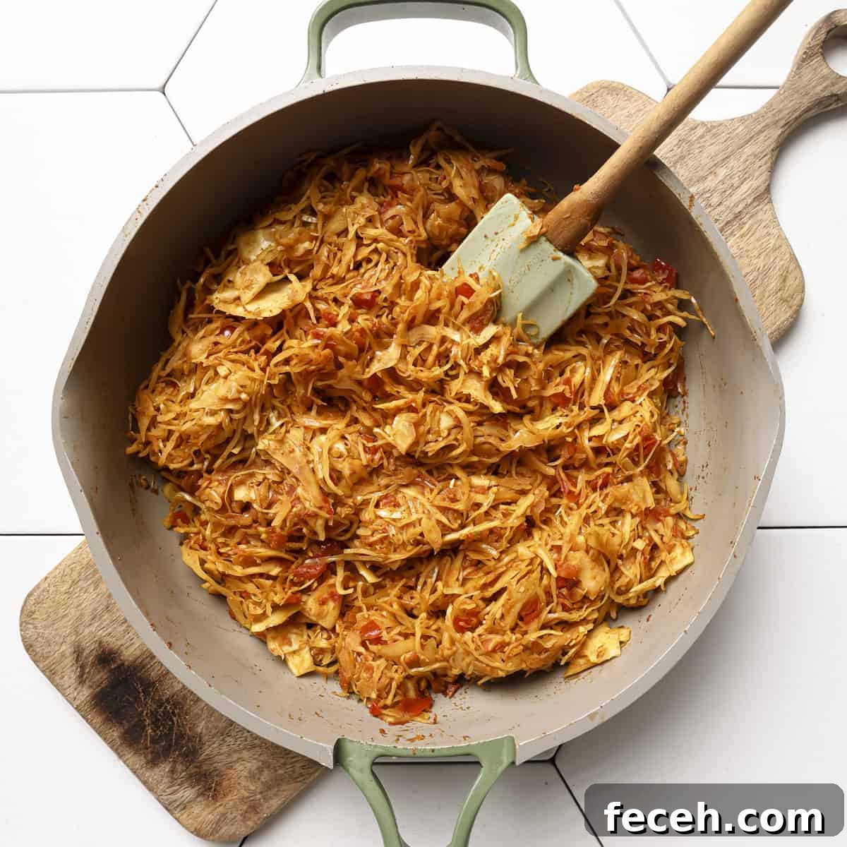 tomato paste and ground spices cooked into the cabbage.